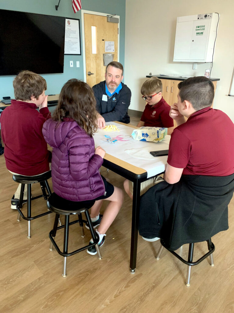 Jason Brooks works with Clayton-Bradley Academy students.